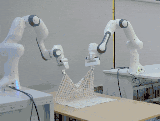 Robot manipulating cloth in simulation next to its real-world counterpart
